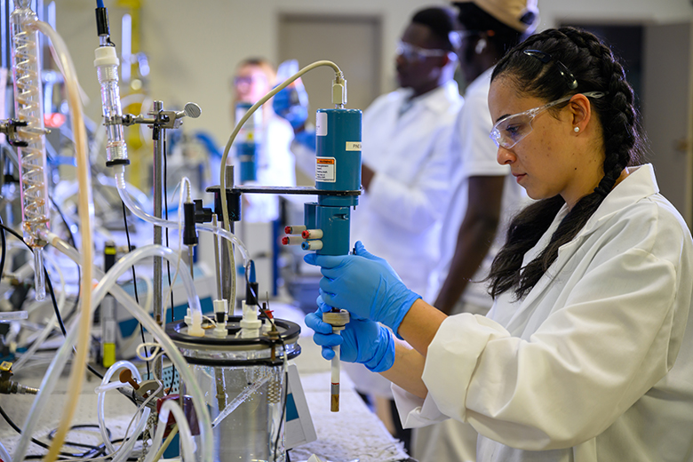 ICMT student works on bench-scale equipment.