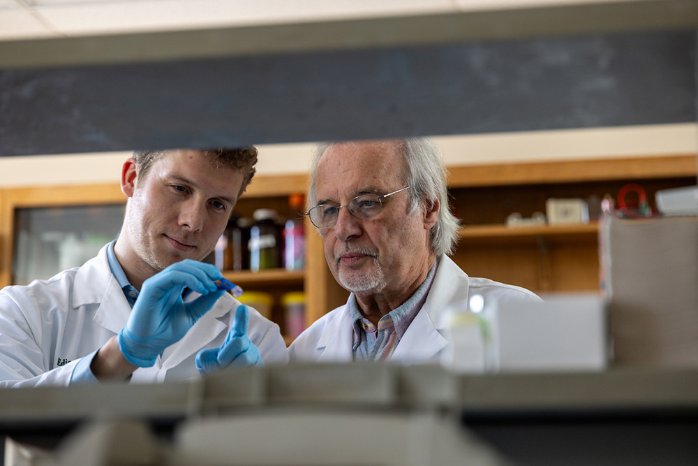 John Kopchick, Ph.D. with a researcher in the lab at Ohio University
