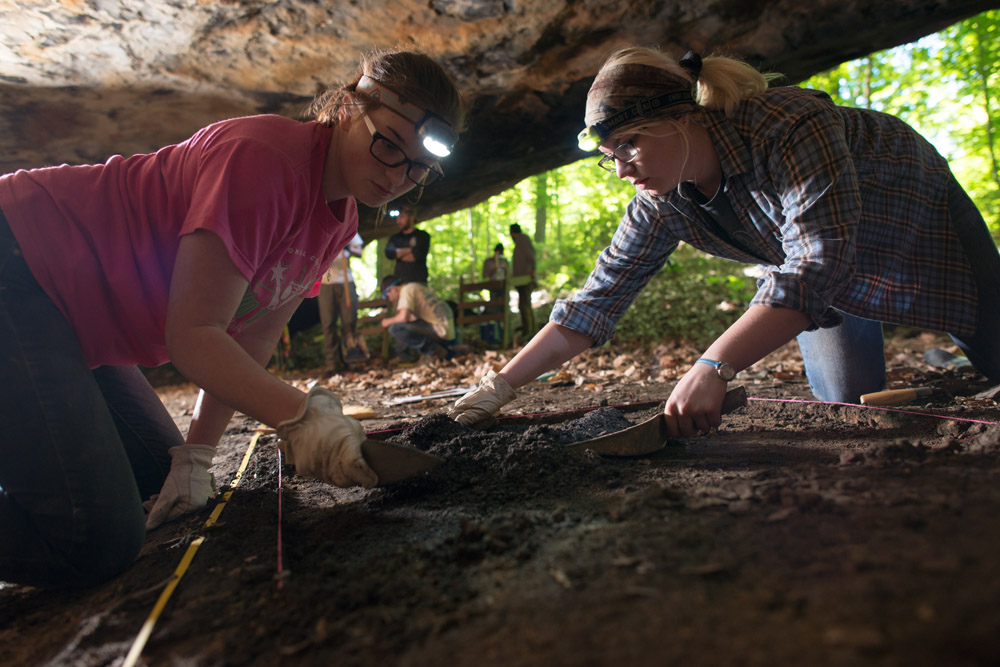 Students excavating in a cave.