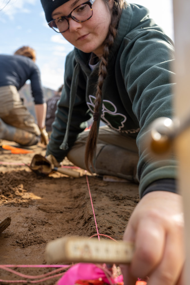 A student excavating the land on the Shoop Paleoindian site.