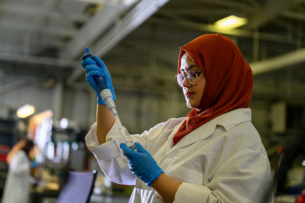 A student engages in research at OHIO's Corrosion Center