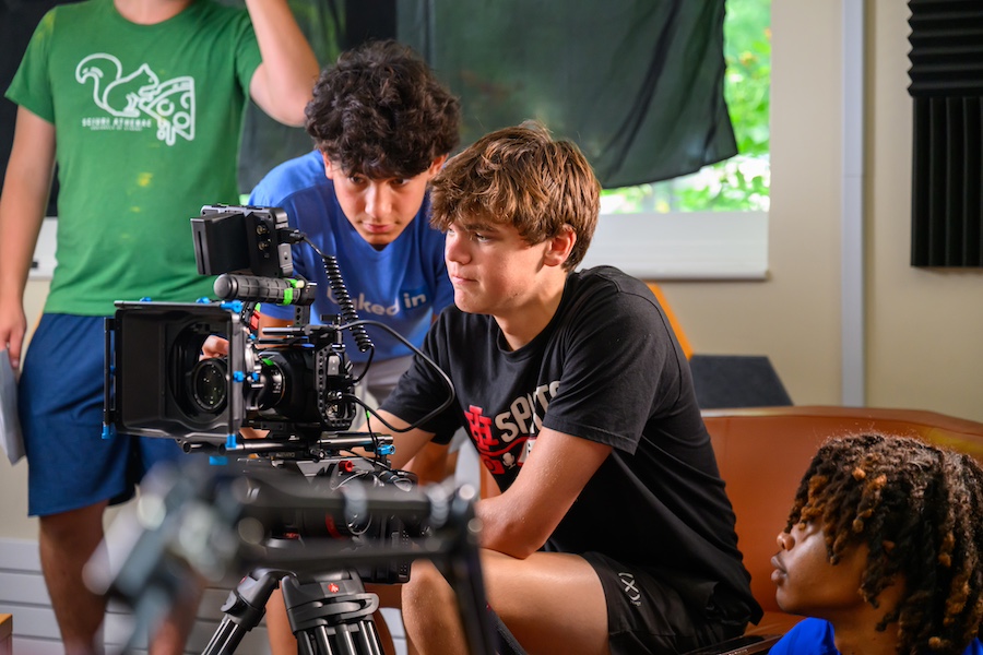 Students working behind camera