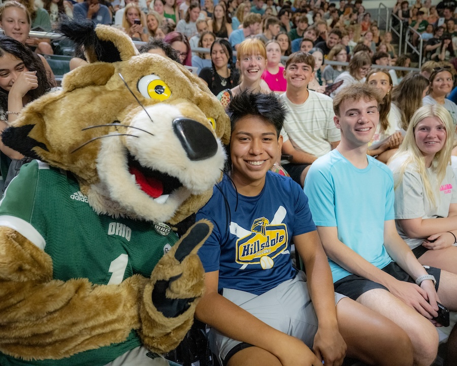 Rufus poses with a new student