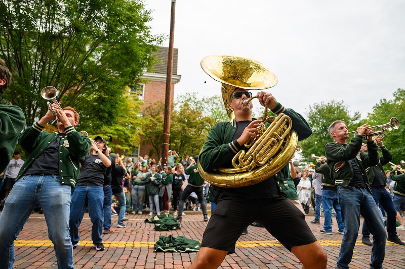 OHIO Alumni Band members perform on Court Street during the 2024 Homecoming Parade