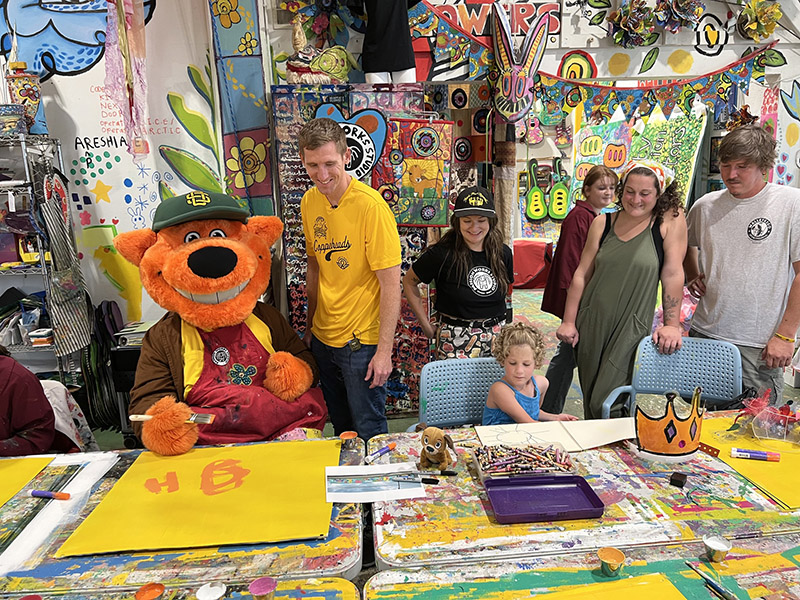 Delaney Lucas at Passion Works Studio with Homer, Southern Ohio Copperheads Mascot.