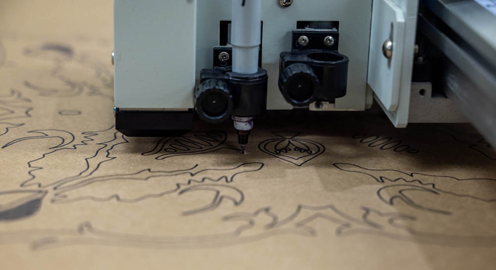 Image of plotter executing a design