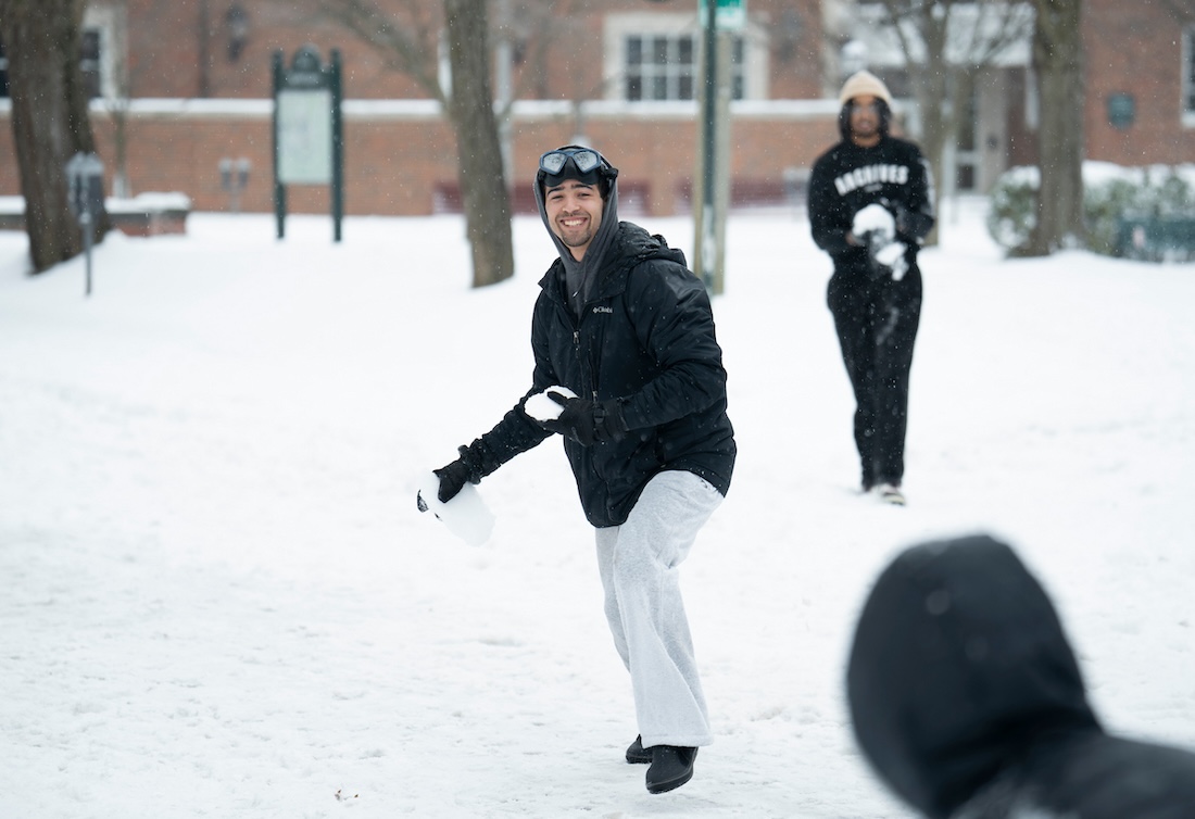 A student throws a snowball
