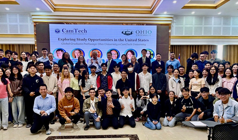 Representatives from CamTech and OHIO stand together for a large group photo at CamTech