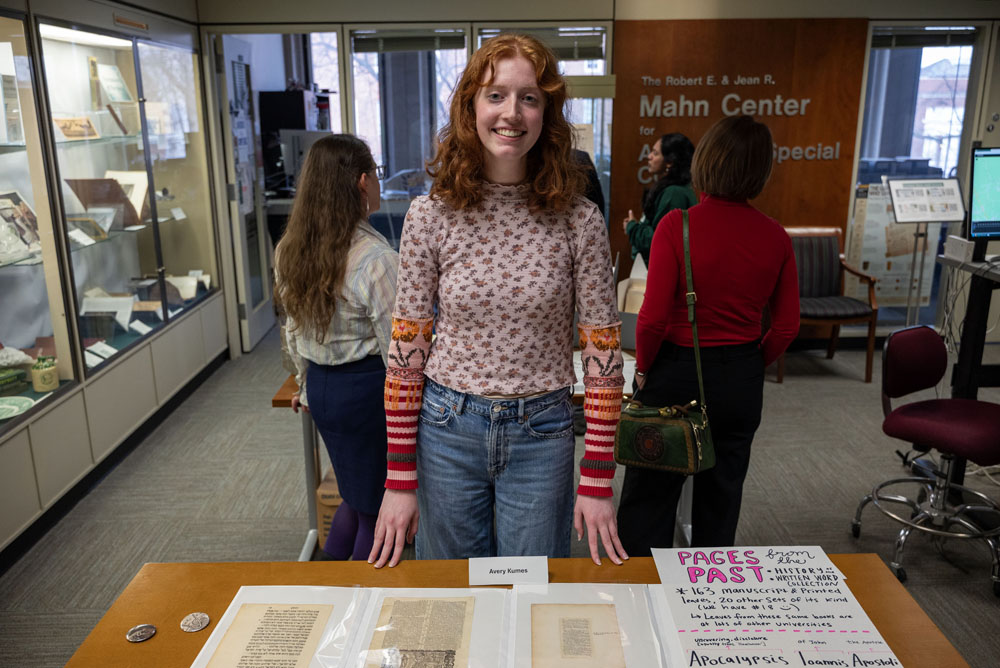 Someone smiling, showcasing their archives exhibit.