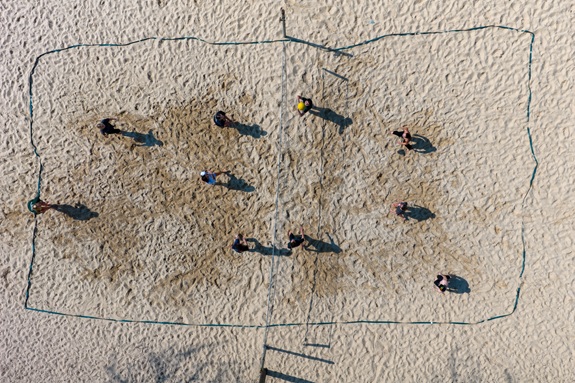 OHIO students play volleyball on a sand volleyball court on the South Green in this image taken from above from a drone camera
