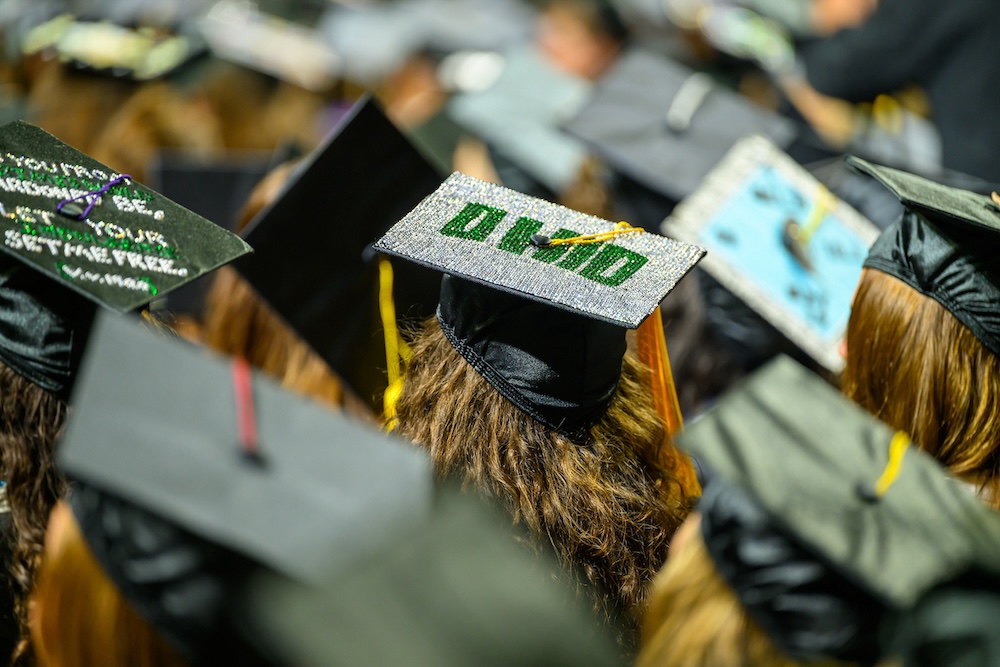 a view of the graduates' caps decorated with sparkling "OHIO" at the Spring 2026 Commencement ceremony