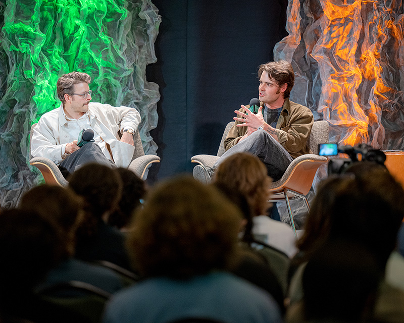 Chris Messina, left, speaks with Jake Ewald, right, during a keynote conversation about songwriting.