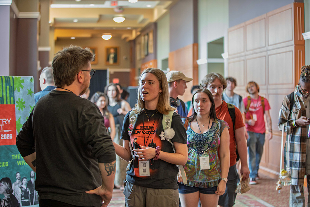 Attendees converse between sessions.