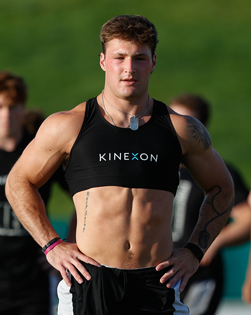 Linebacker Michael Molnar stands on the practice field wearing a GPS tracking vest during OHIO football training.