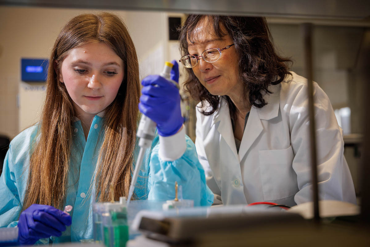 A student learns with the guidance of an OHIO faculty member 