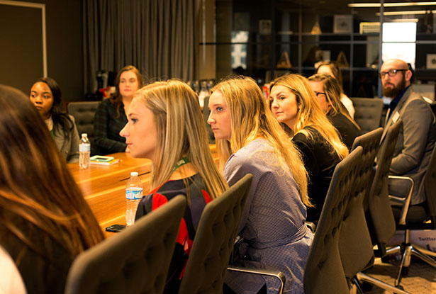 Aaron Sturgill (far right, back), associate director of employer relations at the CLDC, chaperones students during a company visit organized by the OHIO Alumni Association for Chicago Networking Week.