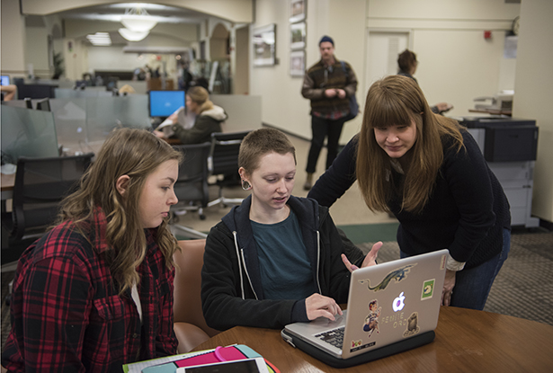 (From left) Stacey Lavender, special collections librarian, consults with Elizabeth Boch, a student majoring in painting and drawing.