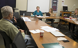 Participants engage in a discussion during a past global perspective FLC.