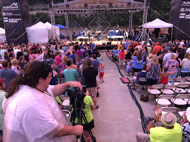 Students operate four cameras that are used to provide the live video stream, projected on Jumbotron screens during Summer Motion, a four-day festival held on the banks of the Ohio River at Ashland, Kentucky.