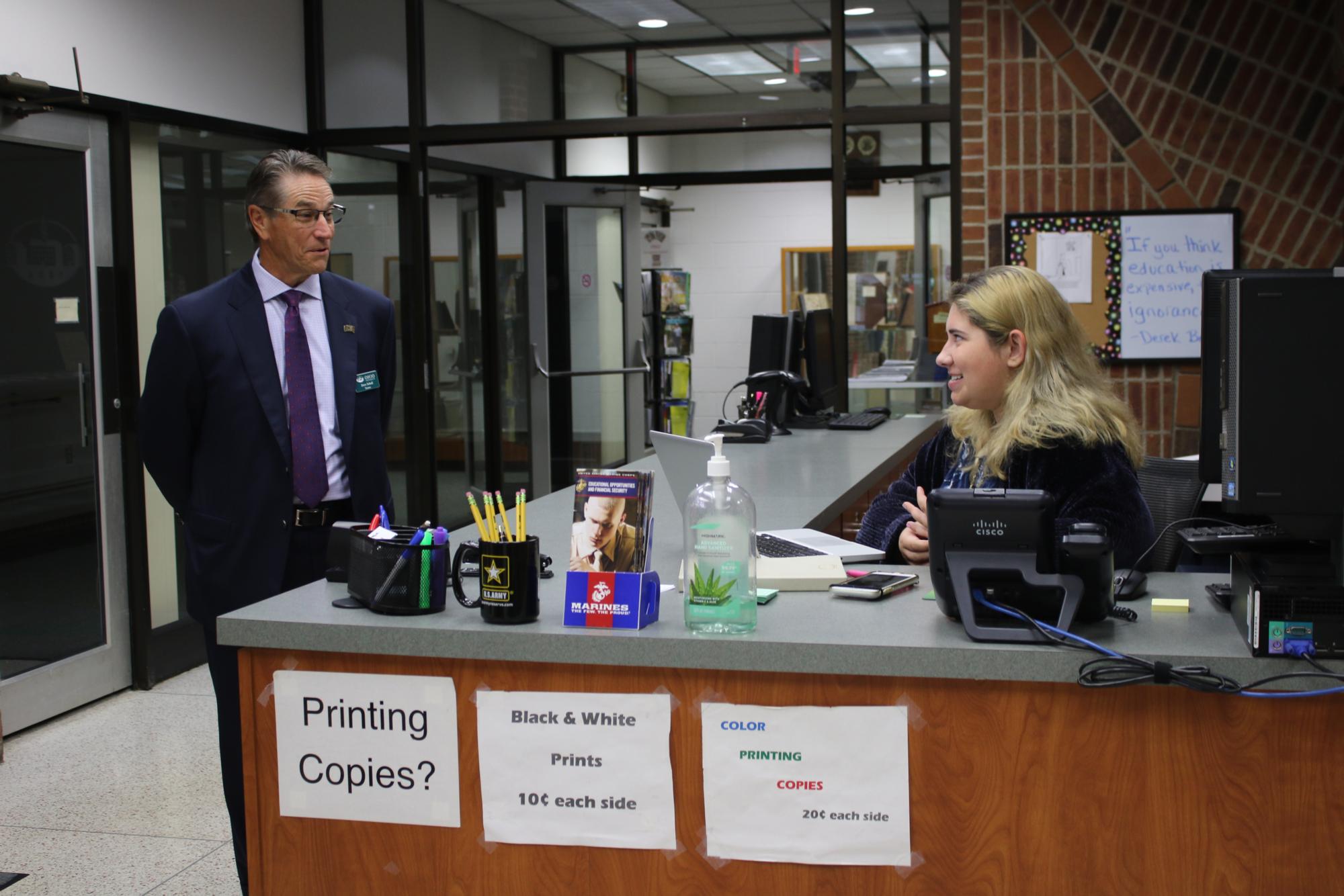 Dave Scholl, Board of Trustees Chair, discusses college life with Chillicothe campus student, Tessa Byers, during a tour of the campus on June 22