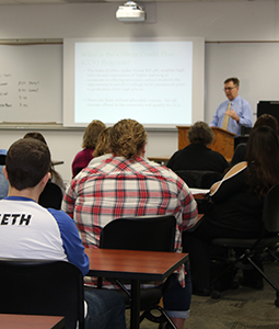 Dr. John Fisher, Director of Student Services, presenting CC+ information