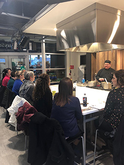 Chef Tim Bruce prepares food in front of his audience