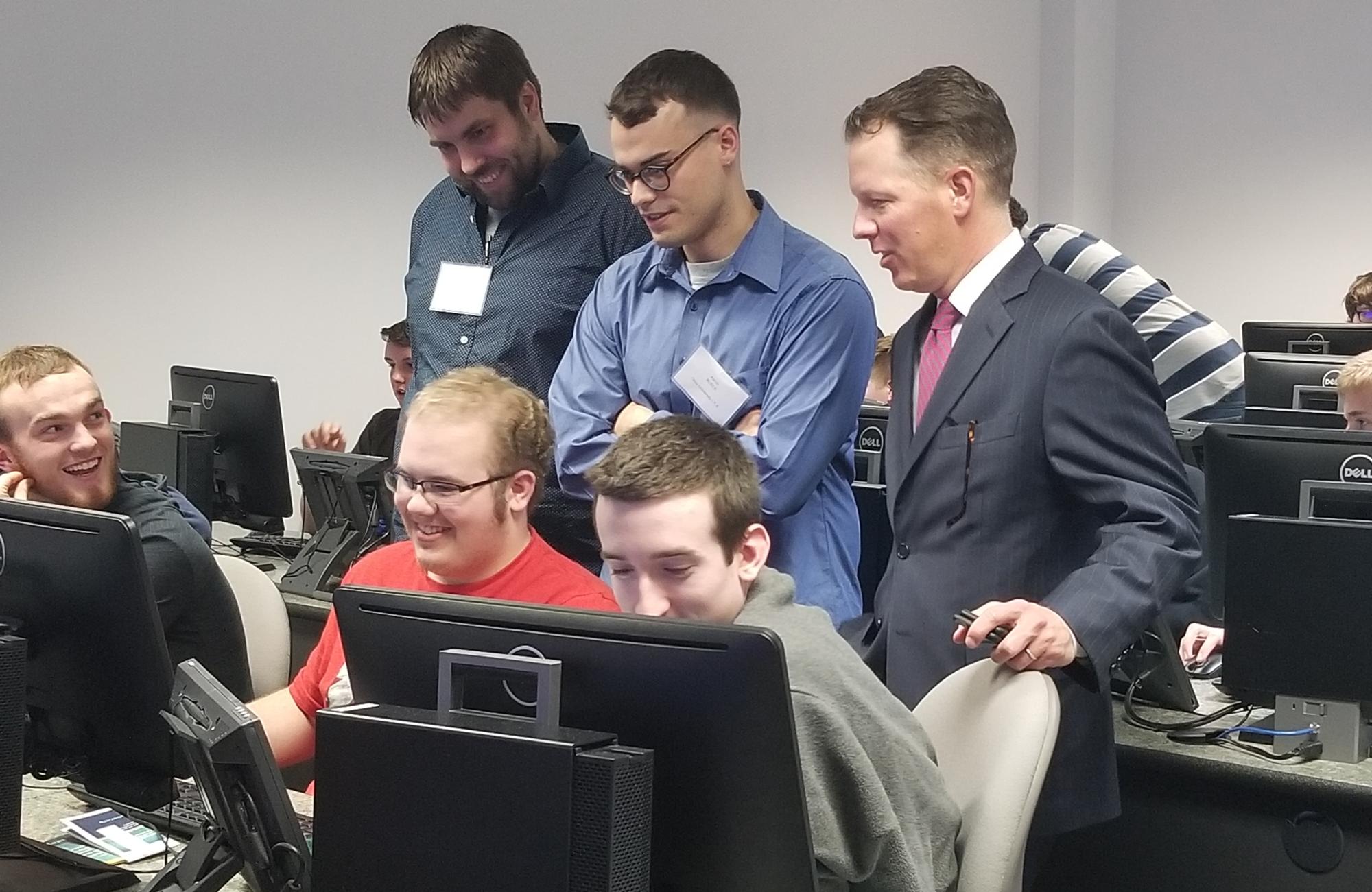 Ryan Burgess, Director of Workforce Transformation at the Governor’s Office, talks with students during the Capture the Flag exercise