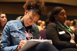 OHIO students and staff take notes and listen as Al Letson delivers advice on having meaningful, constructive conversations.