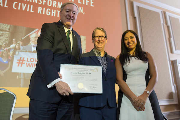 President M. Duane Nellis, left, Dr. Susan Burgess, middle, and Dr. Gerri Botte, right, commemorate Dr. Burgess' Distinguished Professor Award. 