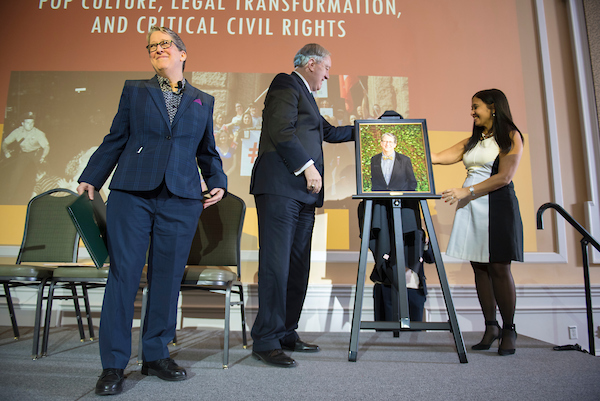 President M. Duane Nellis, left, Dr. Susan Burgess, middle, and Dr. Gerri Botte, right, get the first look at Dr. Burgess' Distinguished Professor portrait.