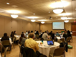 Attendees listen to Julia Paxton present.