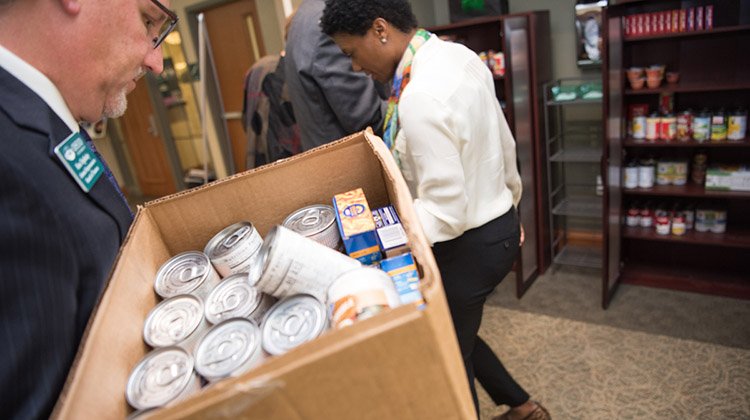 Trustees help stock the Food Pantry in Baker University Center