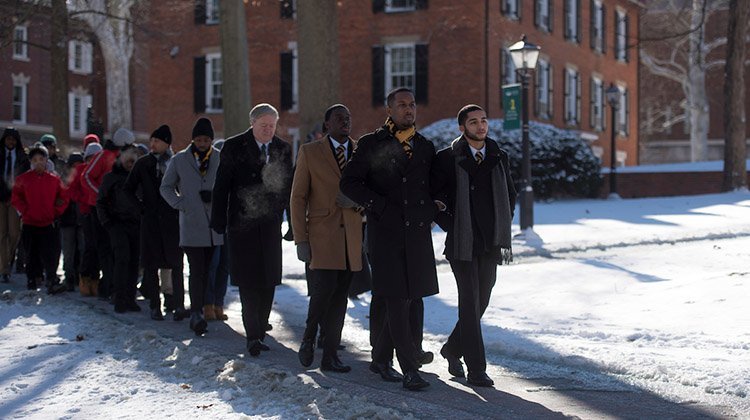 Members of the Alpha Phi Alpha fraternity lead Ohio University’s 2019 Silent March, held on Martin Luther King Jr. Day and in honor of the civil rights leader. 