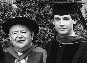 Stuart Blersch, BA ’67, MA ’68, PHD ’75, stands with Professor Neville Rogers on the day he received his hood in 1976. 