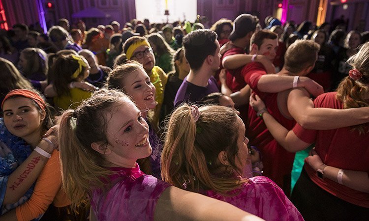 Ohio University students join in circles before team contribution announcements are made at BobcaThon 2019.