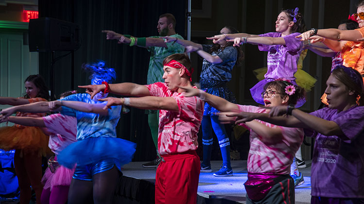 One of BobcaThon’s morale captains, Ian Dickens, leads a line dance alongside fellow morale captains who serve as both cheerleaders and team representatives during the dance marathon. 