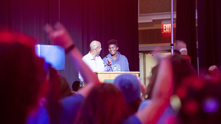 Jason Pina, Ohio University’s vice president for student affairs, shares a laugh with his son, Myles, during the sixth annual BobcaThon.