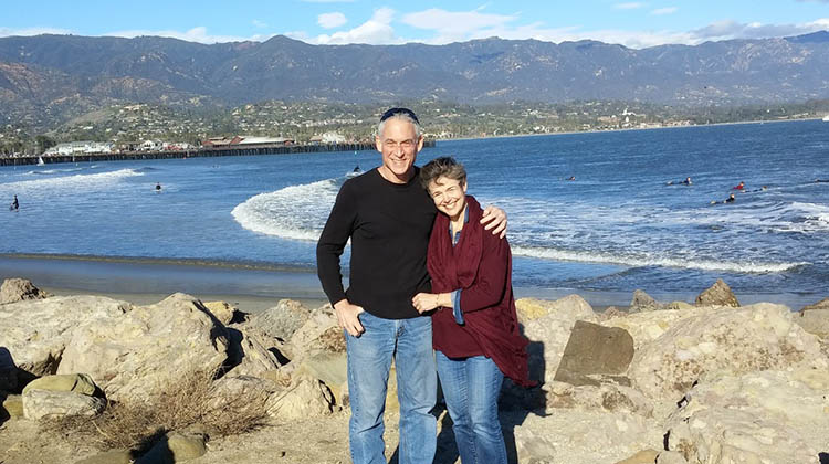 David Levy and his wife, Catherine, posing on vacation