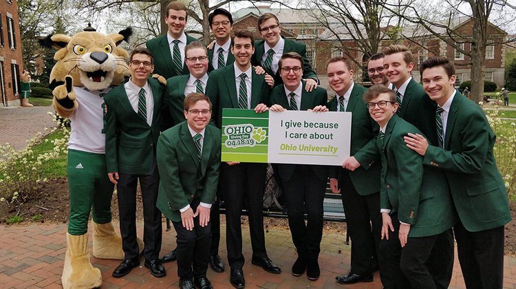 Members of Ohio University’s Singing Men of Ohio joined members of the Marching 110, Rufus and supporters throughout the OHIO community in promoting and celebrating the University’s first-ever Giving Day.