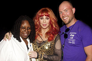 Chris Frederick is pictured with celebrities Whoopi Goldberg and Cher during a 2013 NYC Pride event.