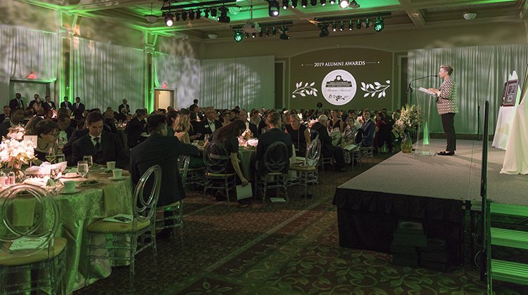 Erin Essak Kopp, assistant vice president of alumni relations and executive director of the Alumni Association, welcomes everyone to the 79th annual Alumni Awards Gala, held Oct. 11 in the Baker University Center Ballroom. Photo by Max Catalano, BSVC ’20