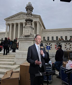 William Messenger speaks to reporters outside of the U.S. Supreme Court.