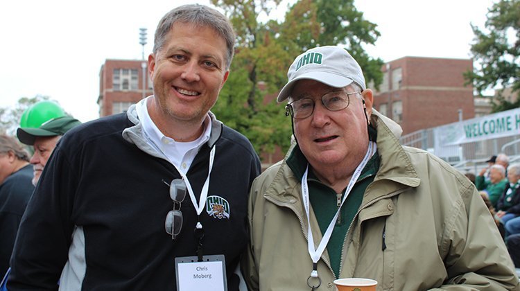 Alumnus Phil Muck, BSCOM ’62, is pictured with Chris Moberg, associate dean of the College of Business, during Ohio University’s 2018 Homecoming Parade.