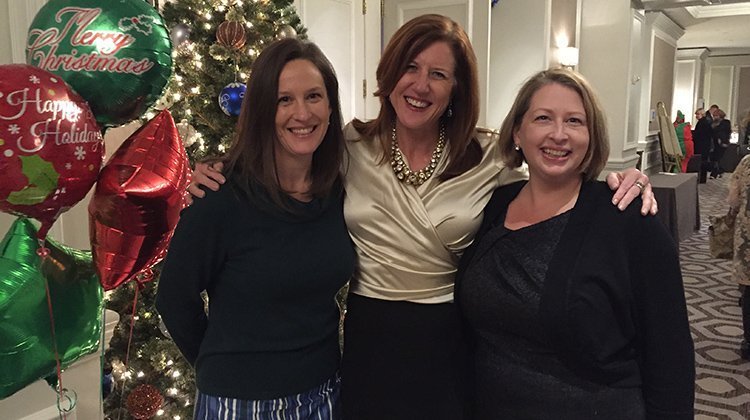 (From left) Monique (Means) McDonough, BBA and BSJ ’95, and Patty (Proebstle) Pae, BBA ’90, are pictured with Julie Green, executive director of New Futures, an organization that provides educational opportunities and pathways to financial stability to under-served young people in the Washington, D.C. region.