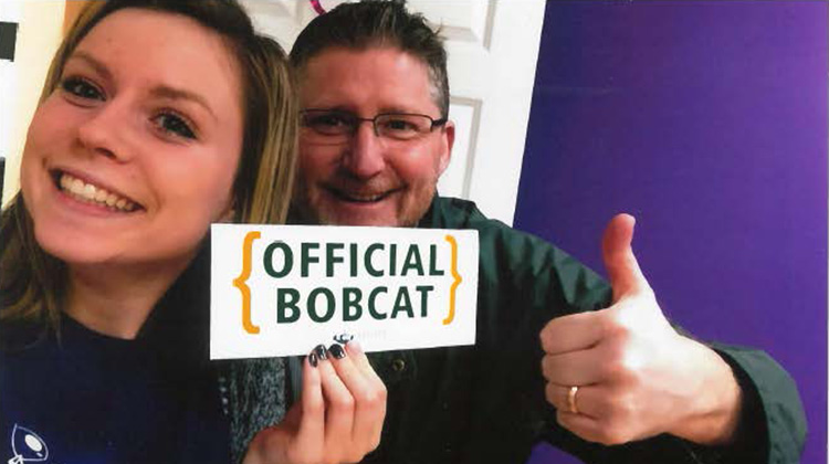 Emily Weidig, BS ’20, and her father, Ohio University alumnus Mark Weidig, BBA ’89, are all smiles in this 2016 photo after Emily received her acceptance letter from the University. A postcard she received from an OHIO graduate through the Postcard Project inspired Emily to follow in her father’s Bobcat footsteps.