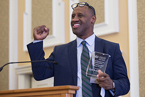 Dell Robinson accepts the Sports Management Undergraduate 2017 Distinguished Alumni Award during the Darren Butler Sports Business Forum. 