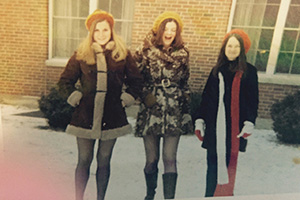 Former Ryors Hall residents Kathy Drummer, BSED ’73, (left) and Jan (Cunningham) Hodson, BSHEC ’73, MSHCS ’96, (center) are pictured outside of Ryors Hall in the winter of 1971, sporting the typical attire worn by women – no matter the season – at the time.