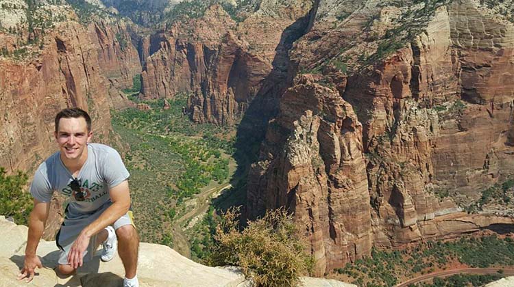 Kyle Triplett pictured atop a canyon.