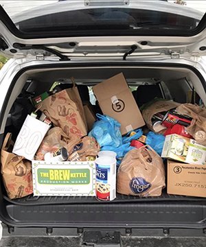 Shawnlee Harrington’s car was filled to the brim with food donations on her way to Athens. 