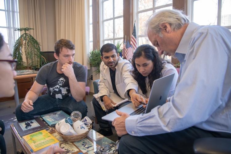 Dr. John Kopchick works on research with students.